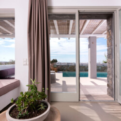 living room with a beautiful terrace at villa ammolite in mykonos