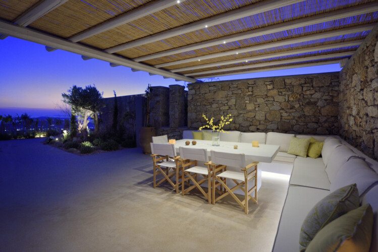 sunset at villa ammolite, picture from the outdoor dining area with a beautiful panoramic view from mykonos