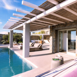 terrace from villa ammolite with private pool, sitting area, sunbeds located in mykonos
