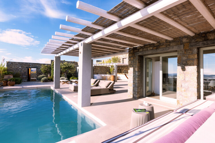 terrace from villa ammolite with private pool, sitting area, sunbeds located in mykonos