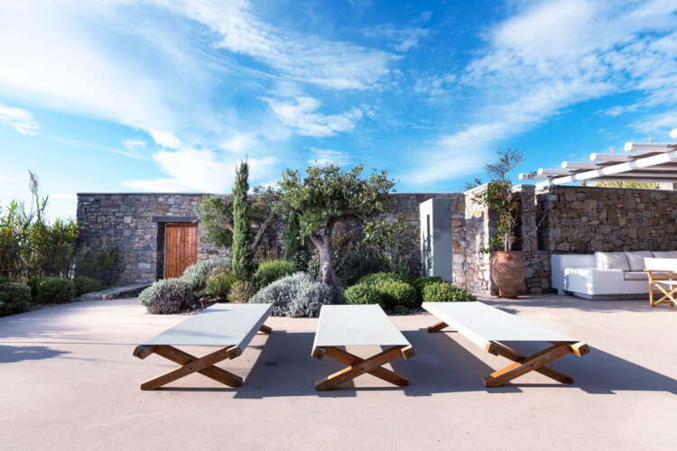 sunny day at the terrace with sunbeds at villa ammolite in mykonos