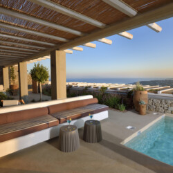 swimming pool with a beautiful view of the greek island mykonos