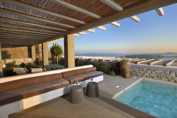 swimming pool with a beautiful view of the greek island mykonos