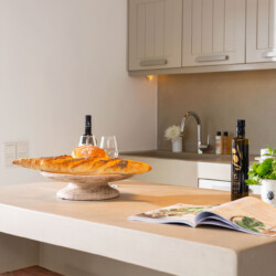 kitchen with neutral tones and minimalistic interior design at villa ammolite in mykonos