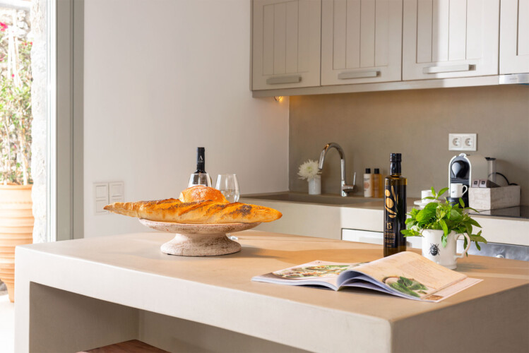 kitchen with neutral tones and minimalistic interior design at villa ammolite in mykonos